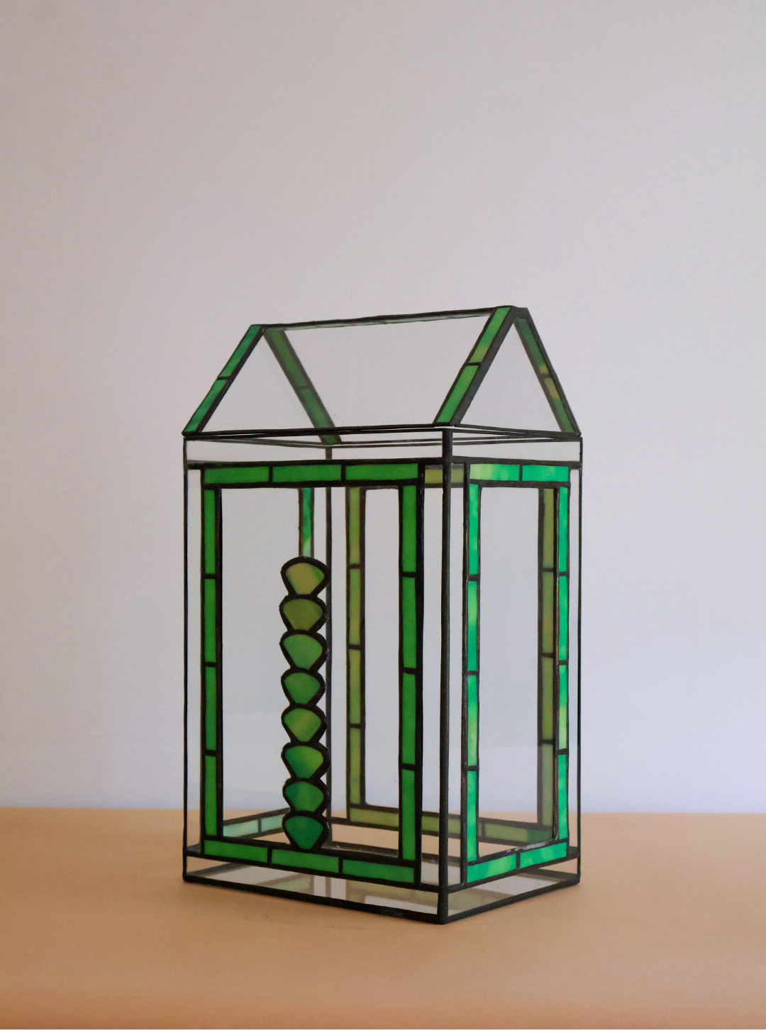 Stained glass terrarium with a succulent design