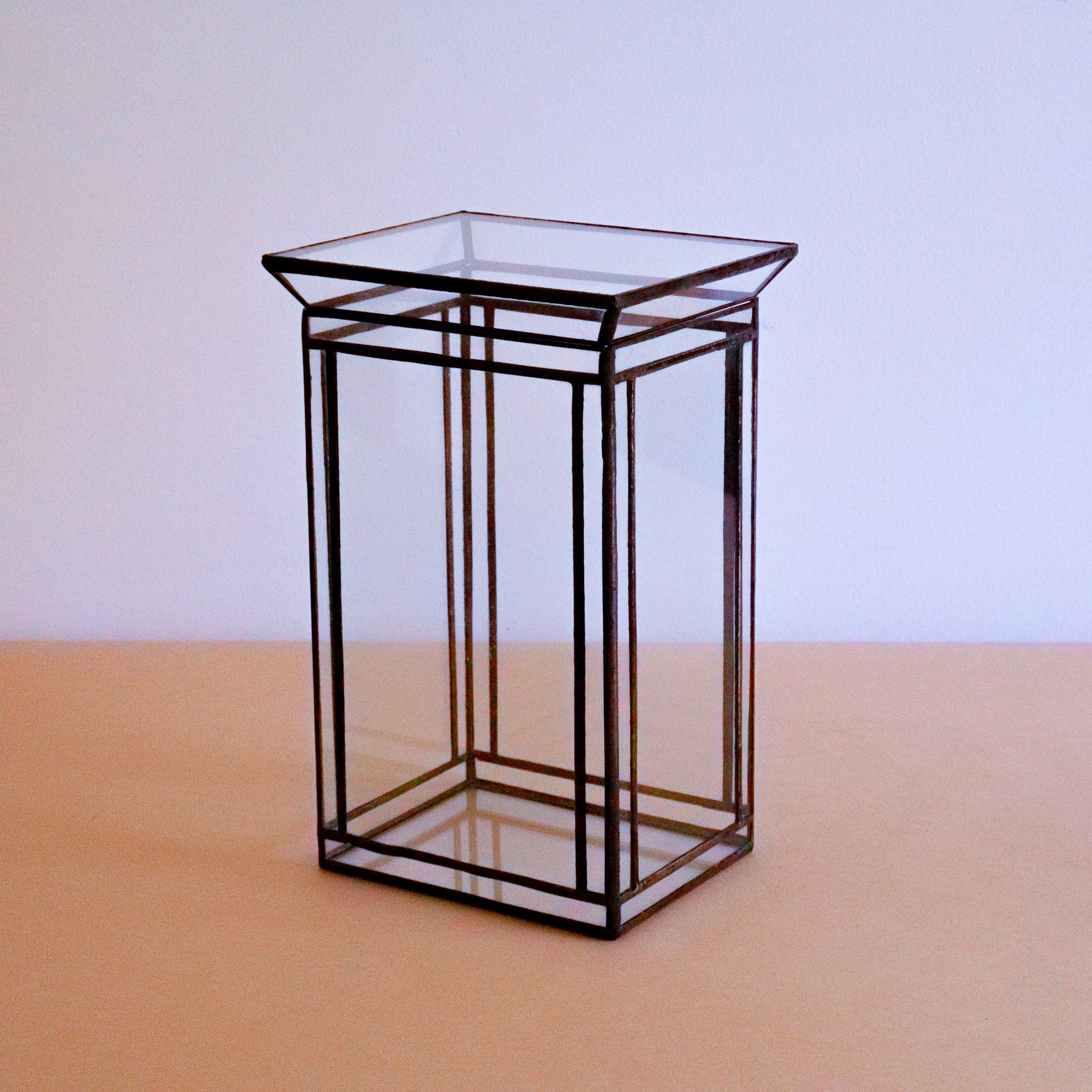 A large handmade glass terrarium 
